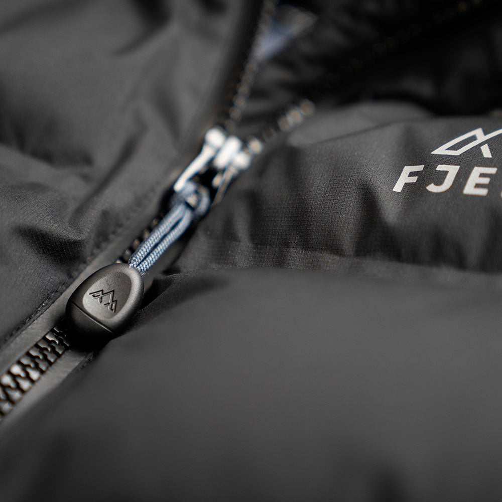 Fjern - Womens Aska Waterproof Down Jacket (Black/Storm) | Introducing the Women's ASKA Eco Waterproof Down Jacket—the ultimate fusion of warmth and style