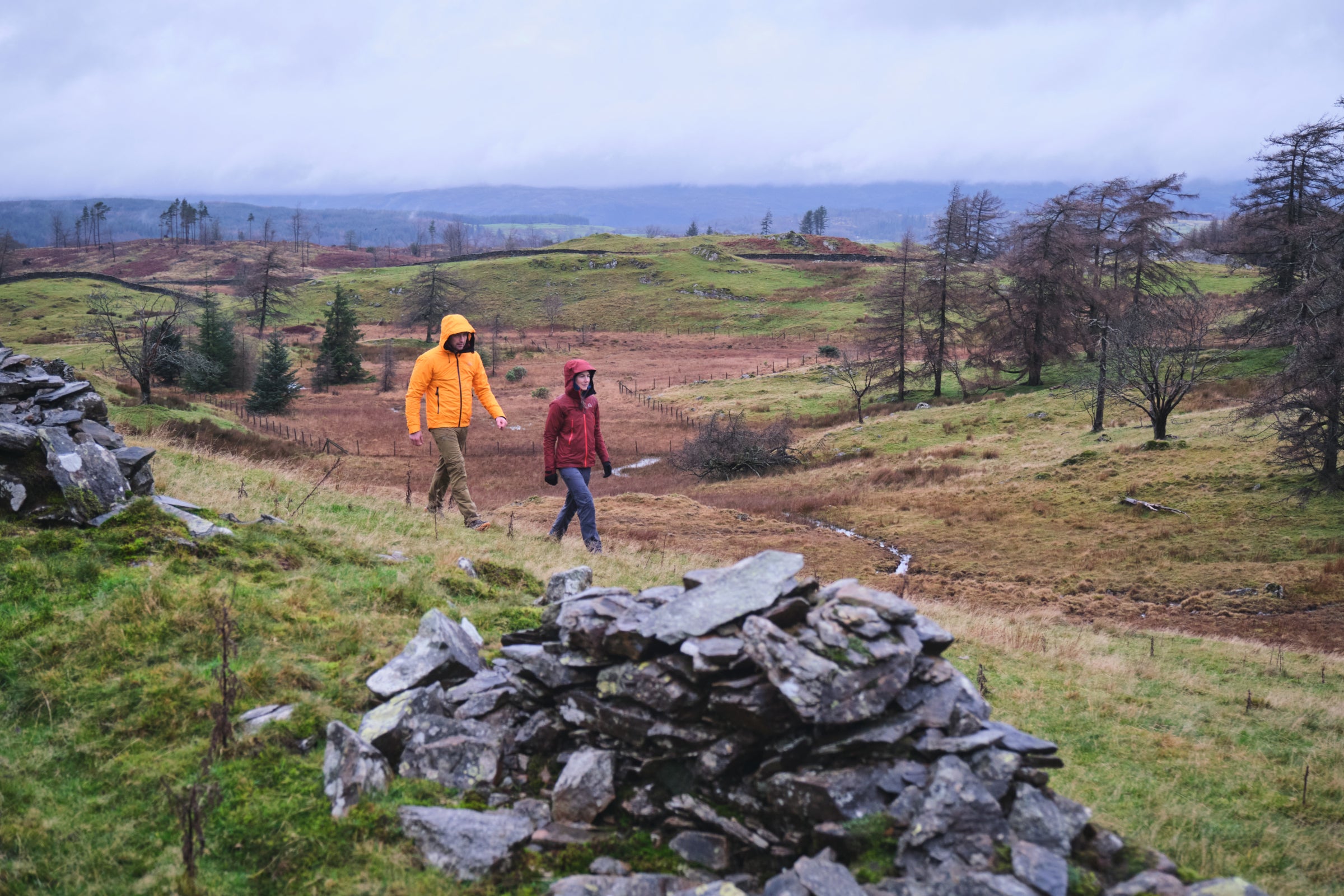 Hiking across a Lake District moor in Fjern Orkan & Skjold Jackets