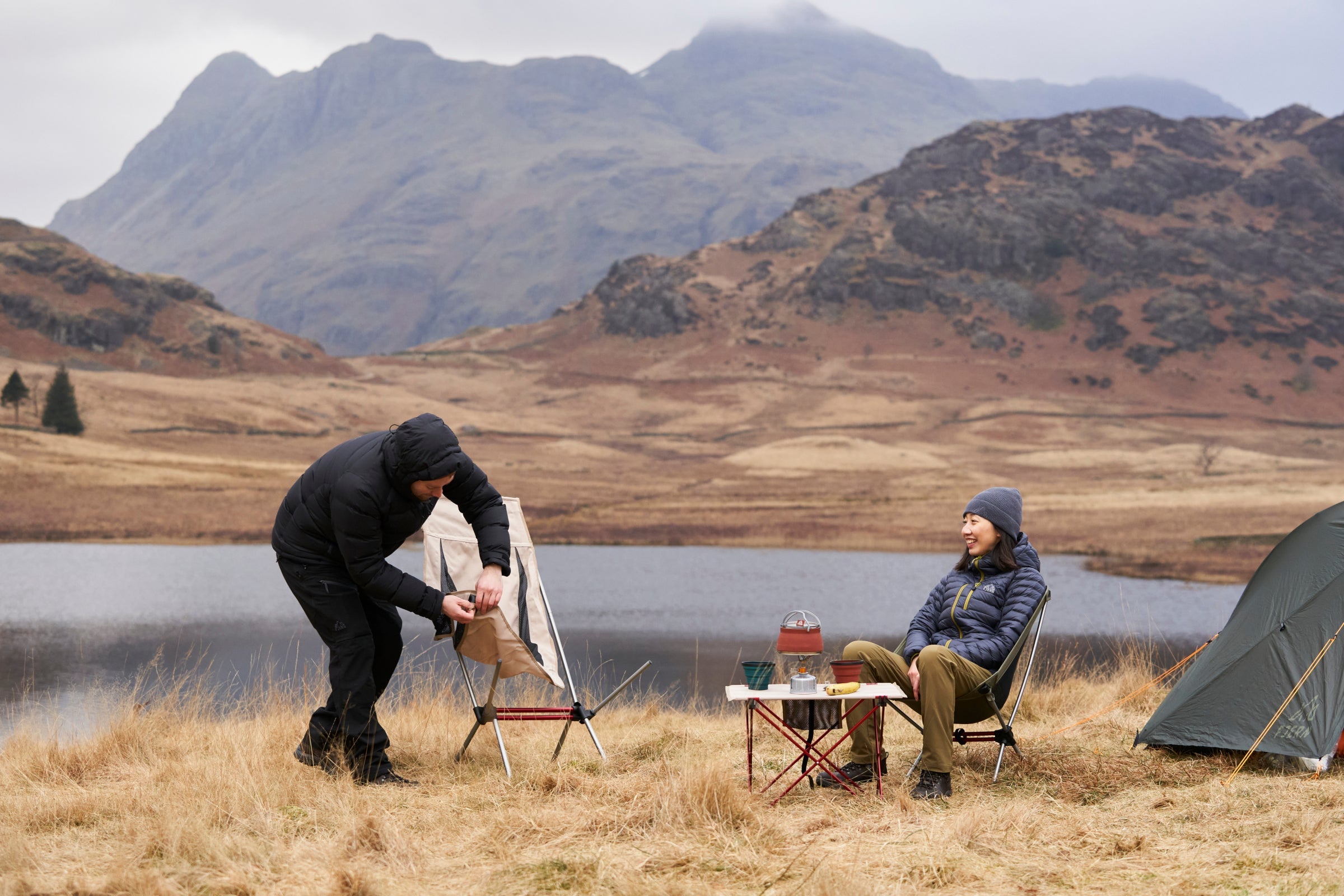 Fjern camping furniture in use by a lake, featuring a lightweight chair and table setup in the outdoors