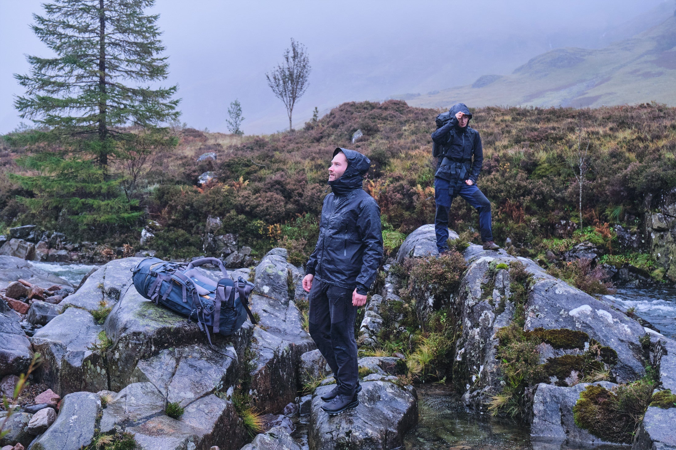 Fjern Orkan Jackets in 'Stealth' colourway on a rainy Highland moor