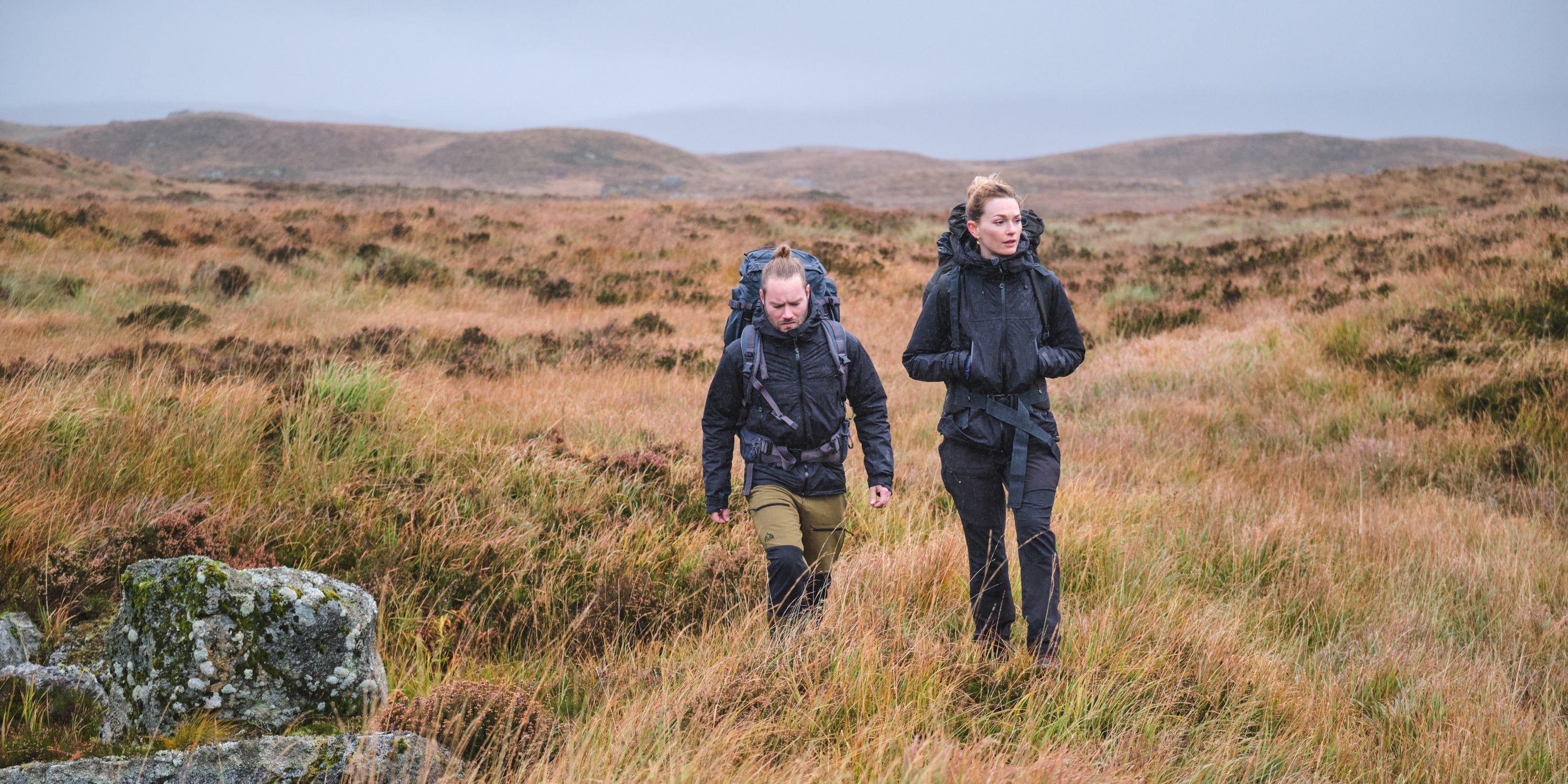 Fjern Jackets in 'Stealth' colourway being put to the test on a rainy Highland moor
