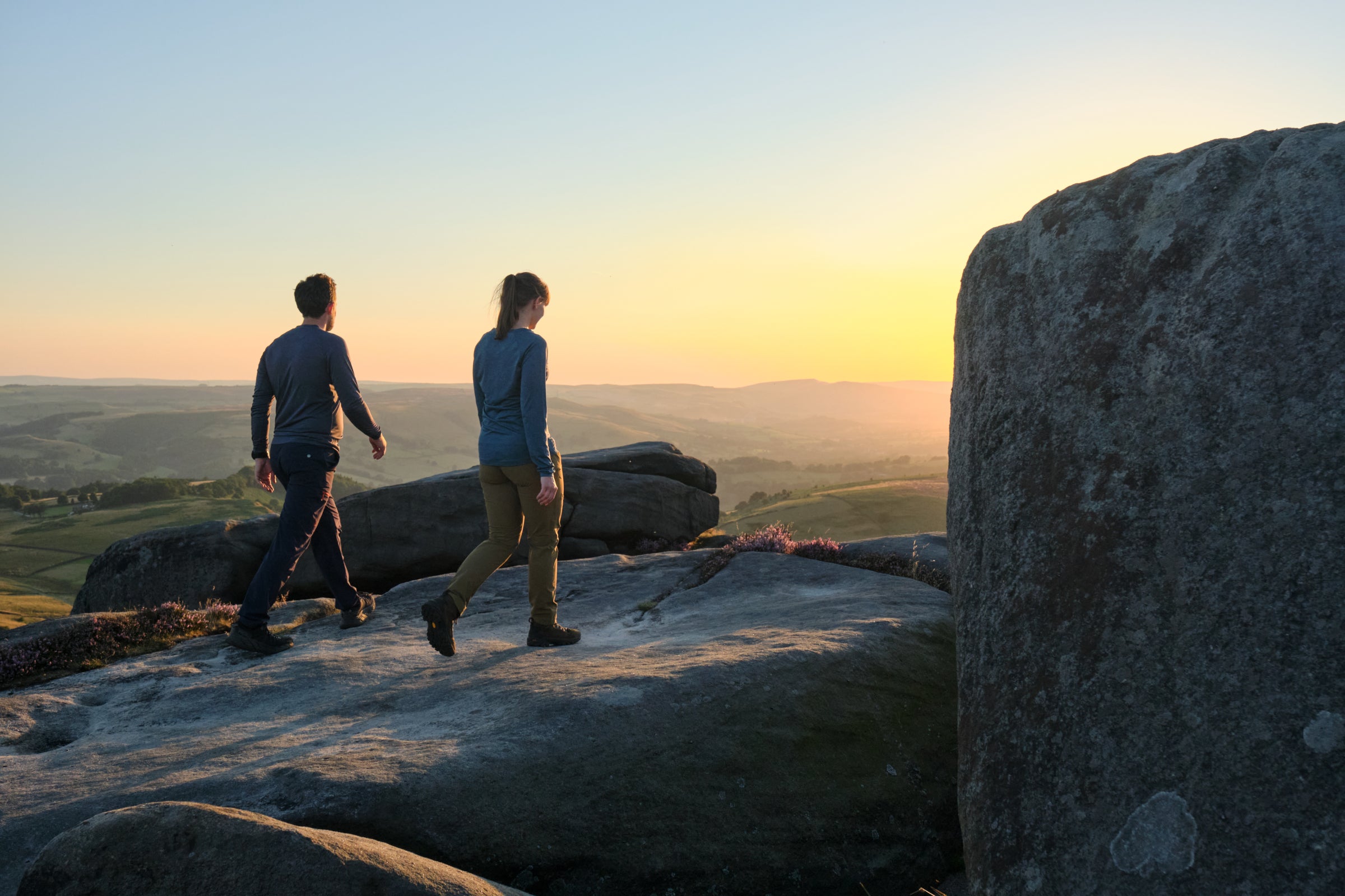 Two hikers on a rock face