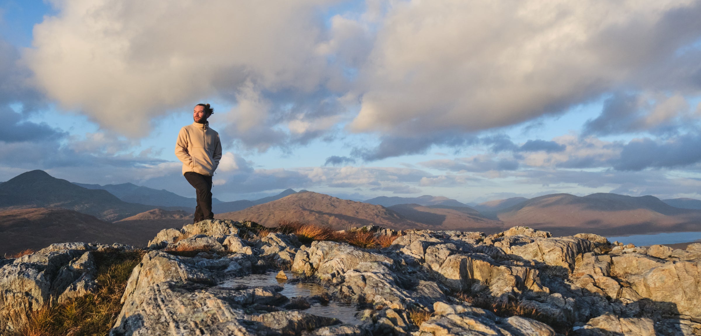 A hiker on a mountain summit
