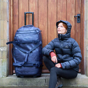 Fjern - Orädda 105L Wheeled Bag (Midnight) | The Orädda 105L Roller Duffle Bag is a rugged travel companion designed for durability