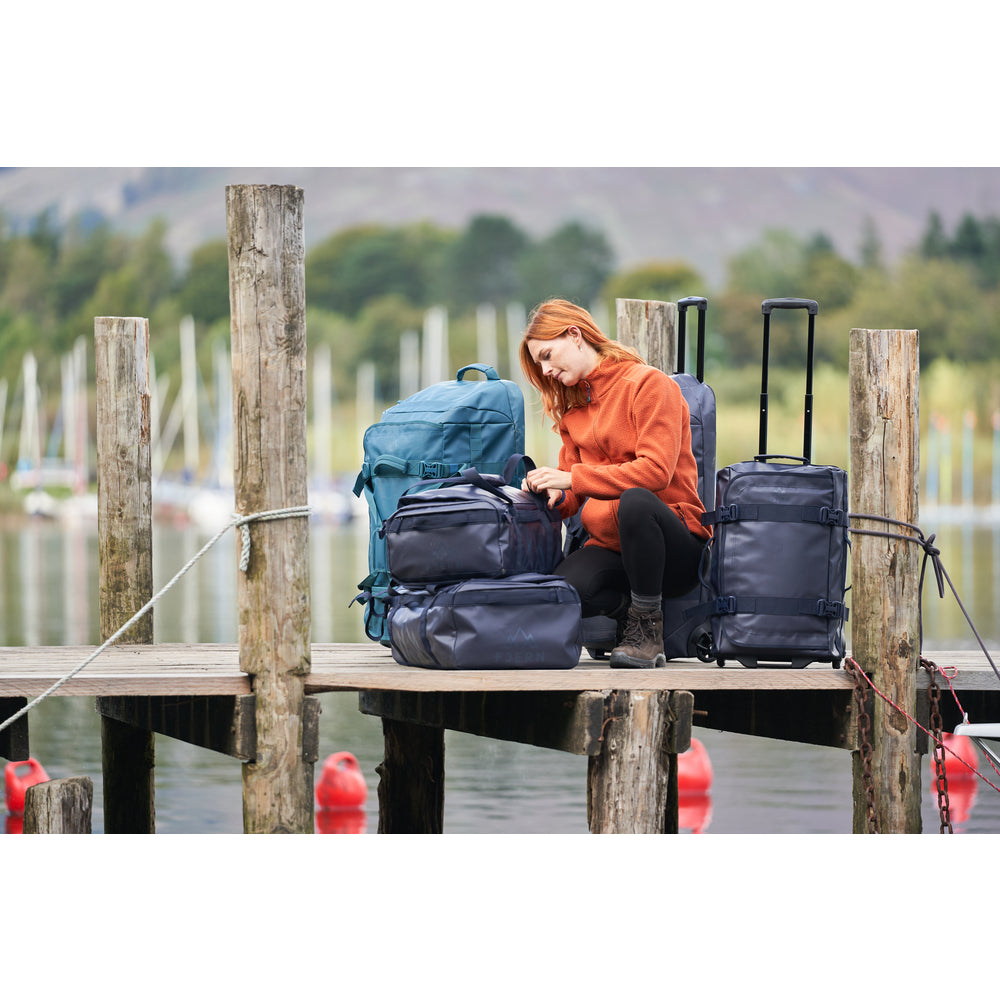 Fjern - Fördra 40L Duffle Bag (Midnight) | Made from durable 100% recycled polyester with a TPU-film laminate, the Fördra duffle bag offers 40L of storage, multiple pockets, and versatile carrying options