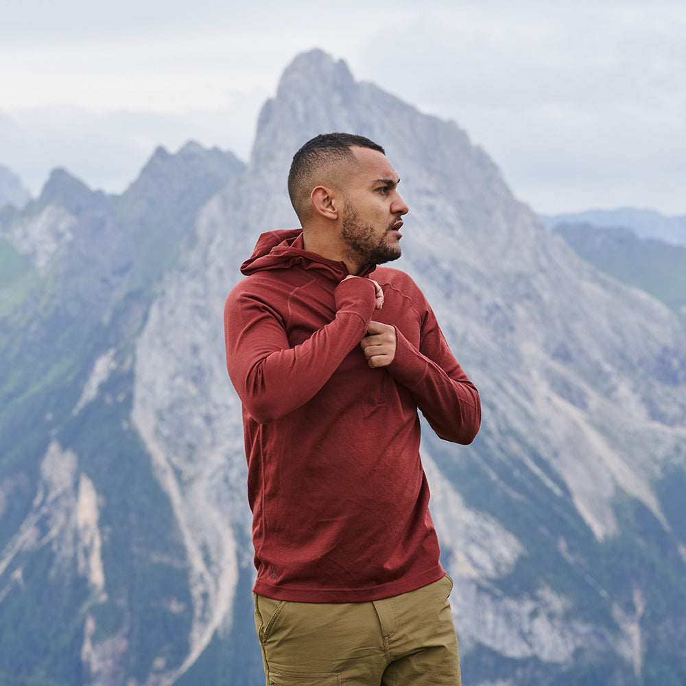 Fjern - Mens Första Merino Blend Long Sleeve Hoodie Baselayer (Rust) | Embark on your next adventure with the Första Hoodie, a lightweight and high-performance technical hoodie