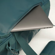 Fjern - Fördra 40L Duffle Bag (Petrol) | Made from durable 100% recycled polyester with a TPU-film laminate, the Fördra duffle bag offers 40L of storage, multiple pockets, and versatile carrying options