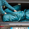 Fjern - Fördra 70L Duffle Bag (Petrol) | Made from durable 100% recycled polyester with a TPU-film laminate, the Fördra duffle bag offers 70L of storage, multiple pockets, and versatile carrying options