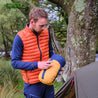 Fjern - Mens Aktiv Down Gilet (Burnt Orange/Navy) | Gear up your alpine performance with the Aktiv Gilet, a versatile and lightweight insulated layer that offers core warmth without the bulk