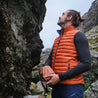 Fjern - Mens Aktiv Down Gilet (Burnt Orange/Navy) | Gear up your alpine performance with the Aktiv Gilet, a versatile and lightweight insulated layer that offers core warmth without the bulk