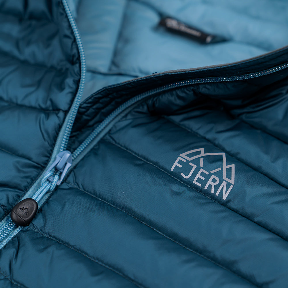 Fjern - Mens Aktiv Down Gilet (Petrol/Arctic Blue) | Gear up your alpine performance with the Aktiv Gilet, a versatile and lightweight insulated layer that offers core warmth without the bulk