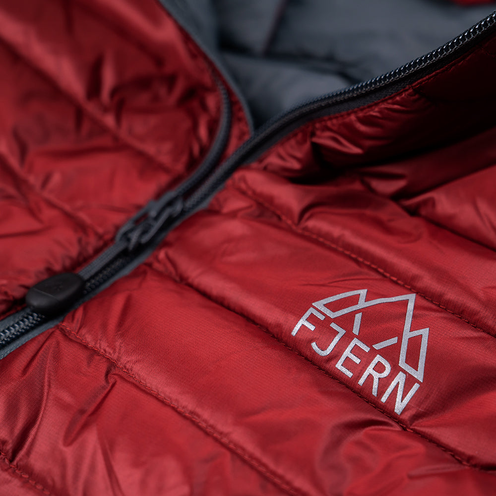 Fjern - Mens Aktiv Down Gilet (Rust/Charcoal) | Gear up your alpine performance with the Aktiv Gilet, a versatile and lightweight insulated layer that offers core warmth without the bulk