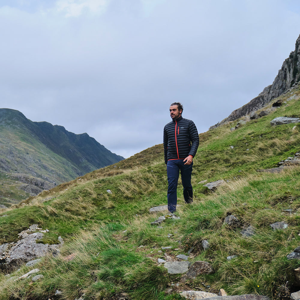 Fjern - Mens Aktiv Down Hoodless Jacket (Black/Orange) | Venture further with the Aktiv, a versatile and lightweight insulated layer that offers exceptional warmth in a compact package