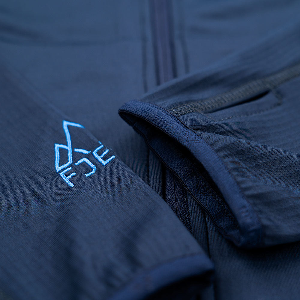 Fjern - Mens Bresprekk Full Zip Fleece (Navy/Cobalt) | Designed for the unpredictable alpine conditions, the Bresprekk features Thermal Stretch Grid Fleece that offers exceptional warmth, breathability, and a comfortable fit