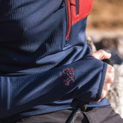 Fjern - Mens Bresprekk Half Zip Grid Fleece (Navy/Rust) | Designed to meet the demands of ever-changing alpine conditions, the Bresprekk functions as both a winter baselayer and a lightweight midlayer
