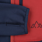 Fjern - Mens Bresprekk Half Zip Grid Fleece (Navy/Rust) | Designed to meet the demands of ever-changing alpine conditions, the Bresprekk functions as both a winter baselayer and a lightweight midlayer