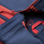 Fjern - Mens Bresprekk Half Zip Grid Fleece (Navy/Rust) | Designed to meet the demands of ever-changing alpine conditions, the Bresprekk functions as both a winter baselayer and a lightweight midlayer