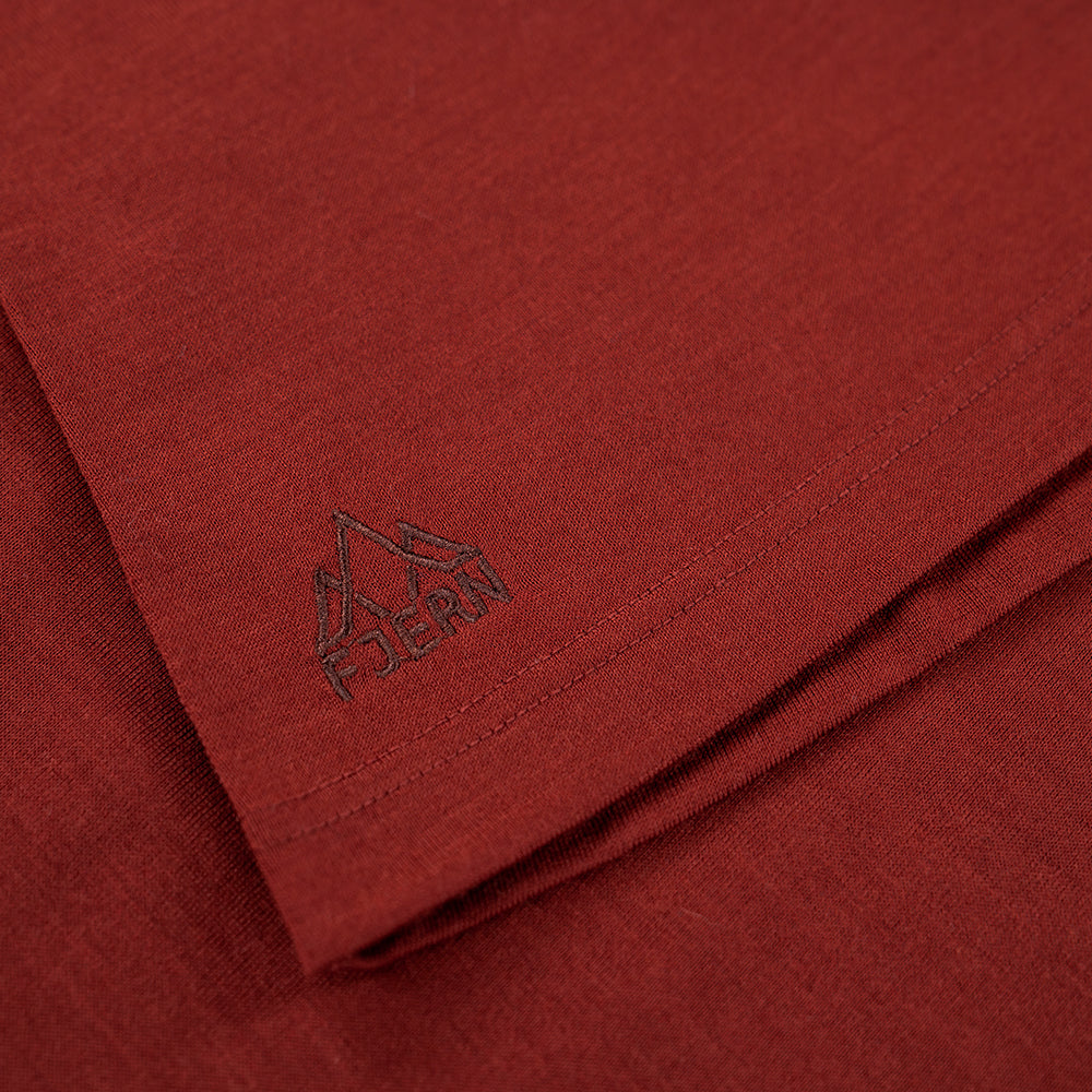 Fjern - Mens Första Merino Blend Long Sleeve Hoodie Baselayer (Rust) | Embark on your next adventure with the Första Hoodie, a lightweight and high-performance technical hoodie