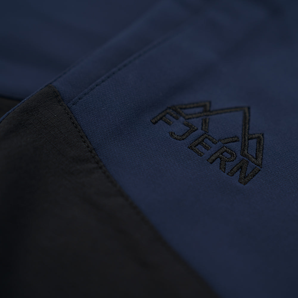 Fjern - Mens Hagna Eco Softshell Trousers (Navy/Black) | Explore the wild with trousers designed for the most challenging terrains