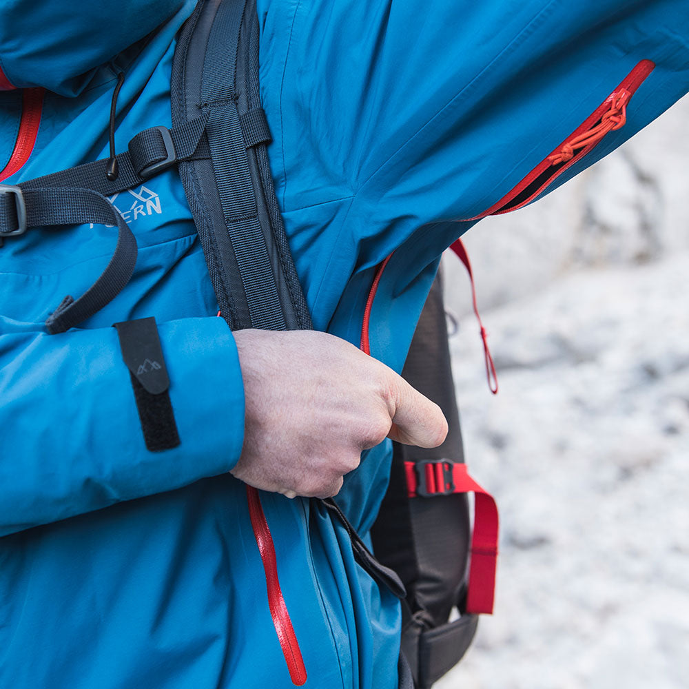 Fjern - Mens Orkan Waterproof Shell Jacket (Teal/Orange) | Face the harshest alpine challenges with confidence in the Orkan jacket, engineered to excel in extreme conditions