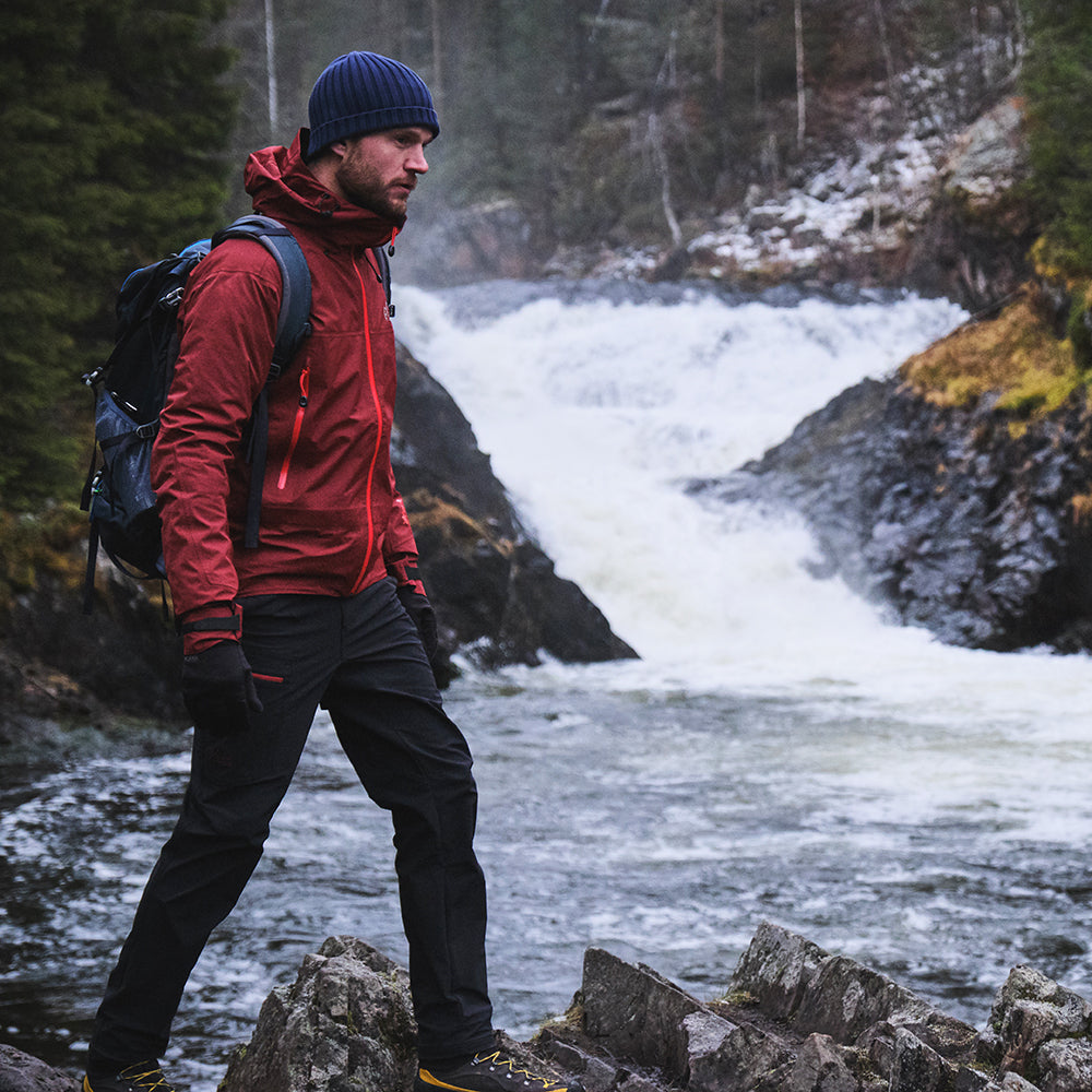 Orange) | Face the harshest alpine challenges with confidence in the Orkan jacket, engineered to excel in extreme conditions