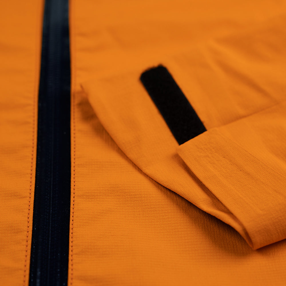 Fjern - Mens Skjold Packable Waterproof Jacket (Sunshine/Navy) | The Skjold is your ultimate shield for fast and light activities, designed to keep you active in any weather