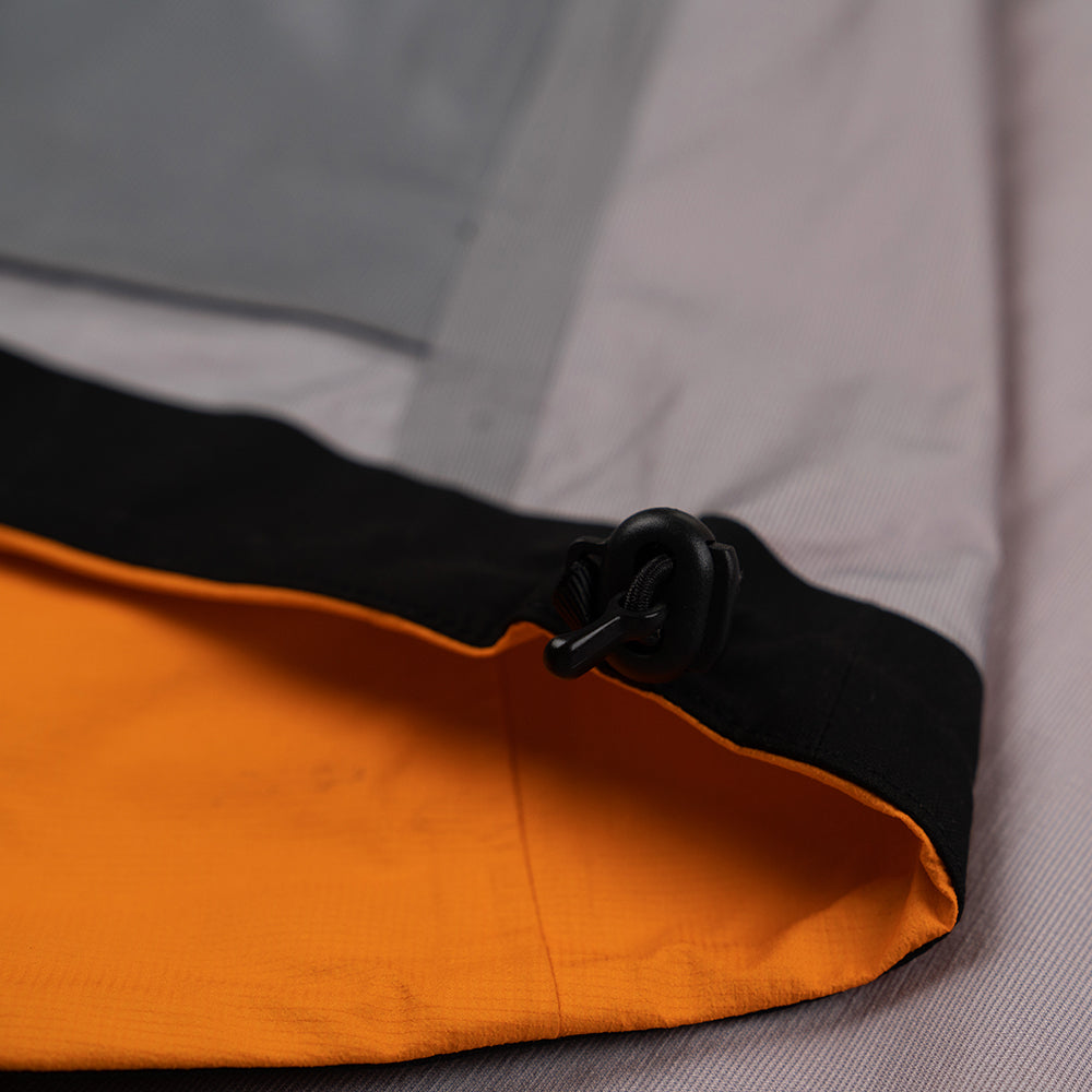 Fjern - Mens Skjold Packable Waterproof Jacket (Sunshine/Navy) | The Skjold is your ultimate shield for fast and light activities, designed to keep you active in any weather