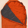 Fjern - Slumra Sleeping Bag Liner (Burnt Orange) | Made from 100% recycled polyester, this versatile liner boosts your sleeping bag's warmth in cool conditions and serves as a standalone bag for warm-weather camping or hostel stays