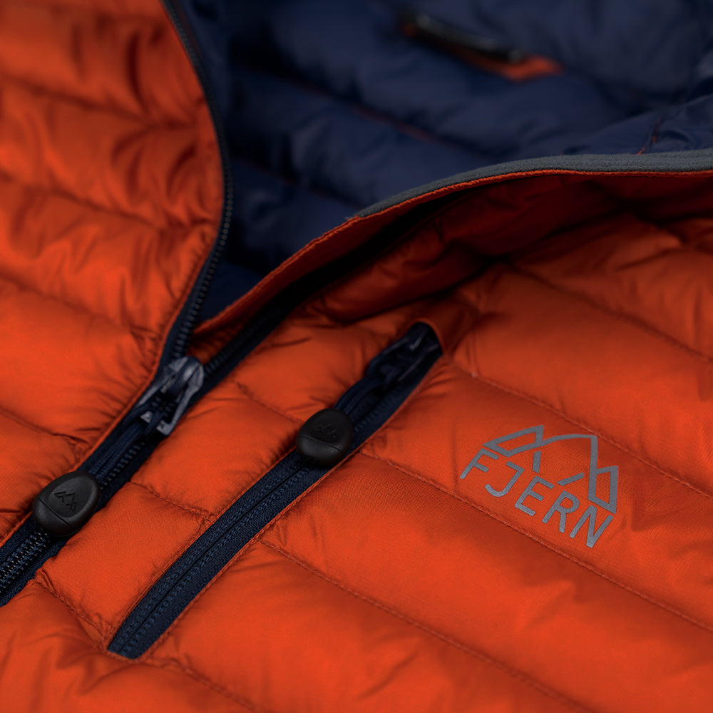 Fjern - Womens Aktiv Down Hoodless Jacket (Burnt Orange/Navy) | Venture further with the Aktiv, a versatile and lightweight insulated layer that offers exceptional warmth in a compact package