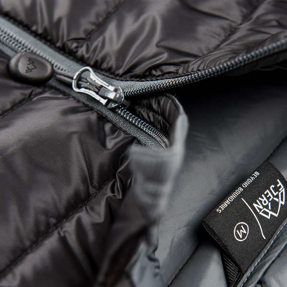 Fjern - Womens Arktis Down Gilet (Black/Charcoal) | Designed to provide core warmth without the weight, this gilet features a clean, sleeveless design for unrestrictive movement during active pursuits