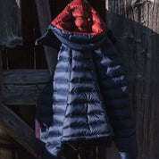 Fjern - Womens Arktis II Down Hooded Jacket (Navy/Rust) | The Arktis II is an incredibly versatile insulated layer that stands strong in brutal conditions