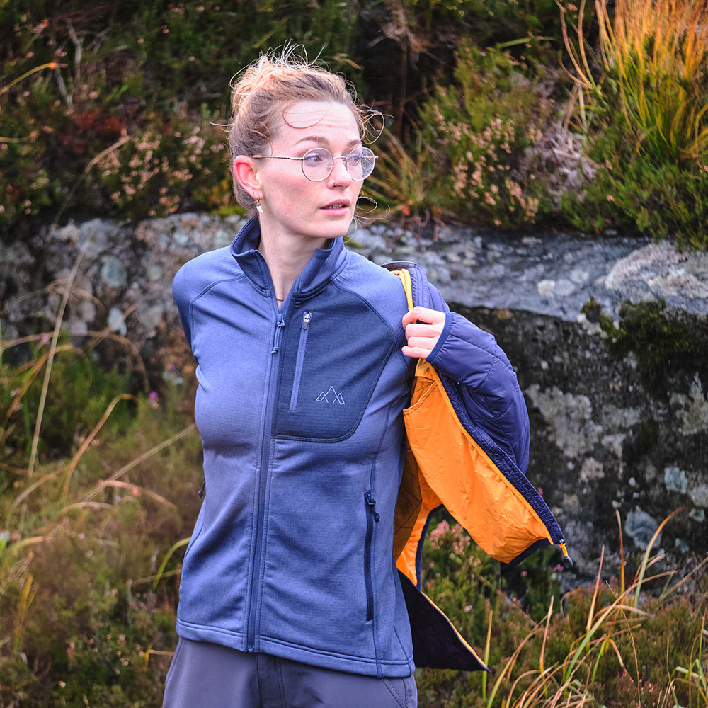 Fjern - Womens Bresprekk Full Zip Fleece (Indigo/Navy) | Designed for the unpredictable alpine conditions, the Bresprekk features Thermal Stretch Grid Fleece that offers exceptional warmth, breathability, and a comfortable fit