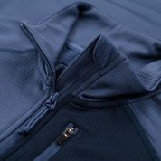 Fjern - Womens Bresprekk Full Zip Fleece (Indigo/Navy) | Designed for the unpredictable alpine conditions, the Bresprekk features Thermal Stretch Grid Fleece that offers exceptional warmth, breathability, and a comfortable fit