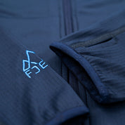 Fjern - Womens Bresprekk Full Zip Fleece (Navy/Cobalt) | Designed for the unpredictable alpine conditions, the Bresprekk features Thermal Stretch Grid Fleece that offers exceptional warmth, breathability, and a comfortable fit