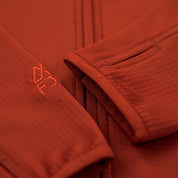 Fjern - Womens Bresprekk Full Zip Fleece (Spice/Orange) | Designed for the unpredictable alpine conditions, the Bresprekk features Thermal Stretch Grid Fleece that offers exceptional warmth, breathability, and a comfortable fit