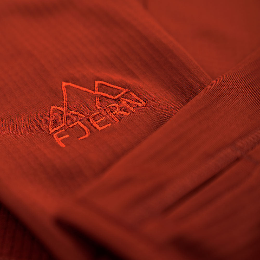 Fjern - Womens Bresprekk Full Zip Fleece (Spice/Orange) | Designed for the unpredictable alpine conditions, the Bresprekk features Thermal Stretch Grid Fleece that offers exceptional warmth, breathability, and a comfortable fit