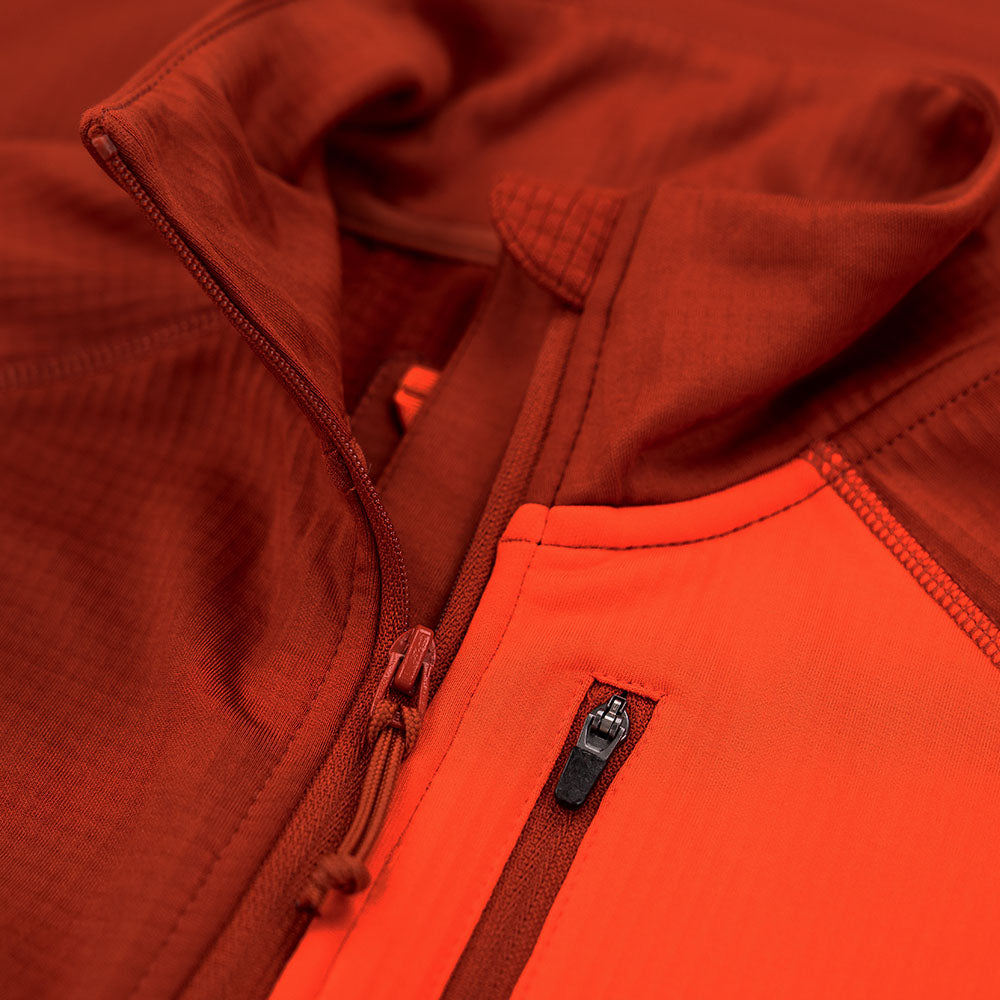 Fjern - Womens Bresprekk Full Zip Fleece (Spice/Orange) | Designed for the unpredictable alpine conditions, the Bresprekk features Thermal Stretch Grid Fleece that offers exceptional warmth, breathability, and a comfortable fit