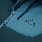 Fjern - Womens Bresprekk Half Zip Grid Fleece (Petrol/Arctic Blue) | Designed to meet the demands of ever-changing alpine conditions, the Bresprekk functions as both a winter baselayer and a lightweight midlayer