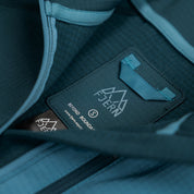Fjern - Womens Bresprekk Half Zip Grid Fleece (Petrol/Arctic Blue) | Designed to meet the demands of ever-changing alpine conditions, the Bresprekk functions as both a winter baselayer and a lightweight midlayer