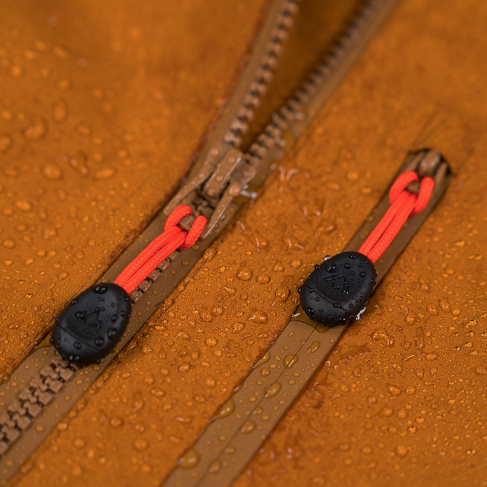 Fjern - Womens Forsvar Eco Waterproof Jacket (Mustard) | A testament to sustainable exploration, the Forsvar integrates planet-conscious waterproofing with a 15k/15k ecoSHIELD® fabric, crafted entirely from recycled polyester