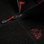 Fjern - Womens Koselig Polartec Fleece Jacket (Black/Rust) | Stay warm and cosy on your alpine adventures with our mid-layer Polartec fleece
