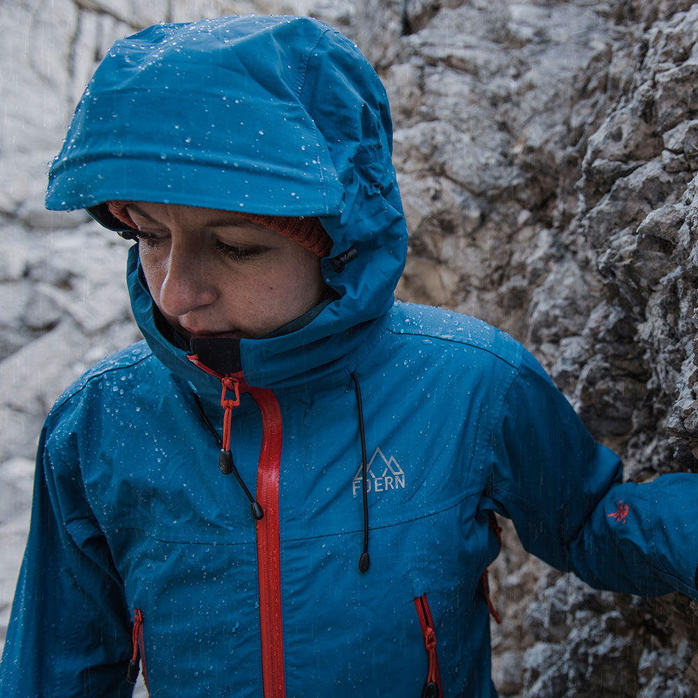 Orange) | Face the harshest alpine challenges with confidence in the Orkan jacket, engineered to excel in extreme conditions