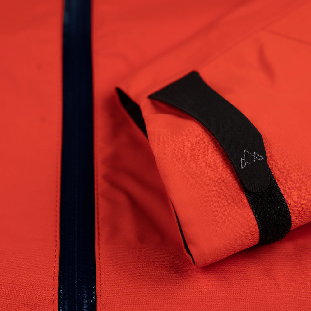 Fjern - Womens Orkan Waterproof Shell Jacket (Orange/Navy) | Face the harshest alpine challenges with confidence in the Orkan jacket, engineered to excel in extreme conditions