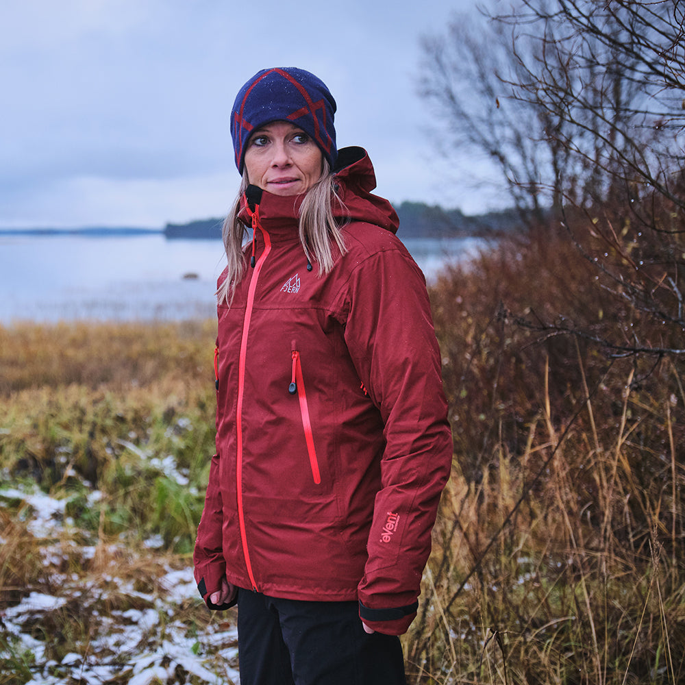 Orange) | Face the harshest alpine challenges with confidence in the Orkan jacket, engineered to excel in extreme conditions
