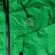 Fjern - Womens Skjold Packable Waterproof Jacket (Green/Pine) | The Skjold is your ultimate shield for fast and light activities, designed to keep you active in any weather
