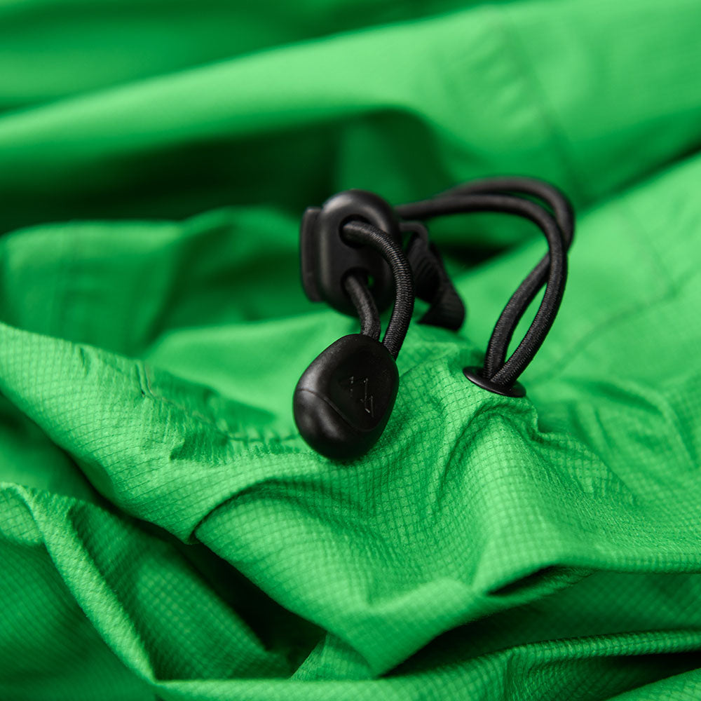 Fjern - Womens Skjold Packable Waterproof Jacket (Green/Pine) | The Skjold is your ultimate shield for fast and light activities, designed to keep you active in any weather