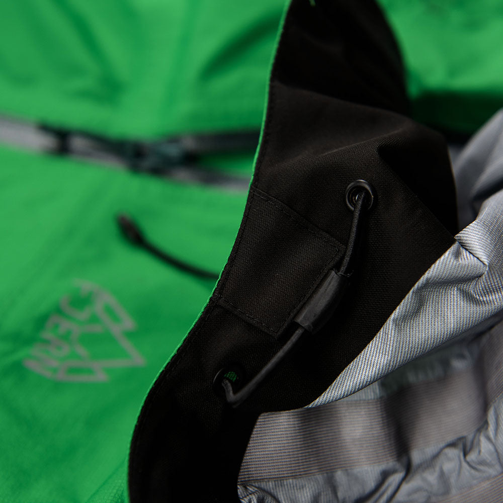 Fjern - Womens Skjold Packable Waterproof Jacket (Green/Pine) | The Skjold is your ultimate shield for fast and light activities, designed to keep you active in any weather