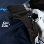 Fjern - Womens Skjold Packable Waterproof Jacket (Navy/Cobalt) | The Skjold is your ultimate shield for fast and light activities, designed to keep you active in any weather
