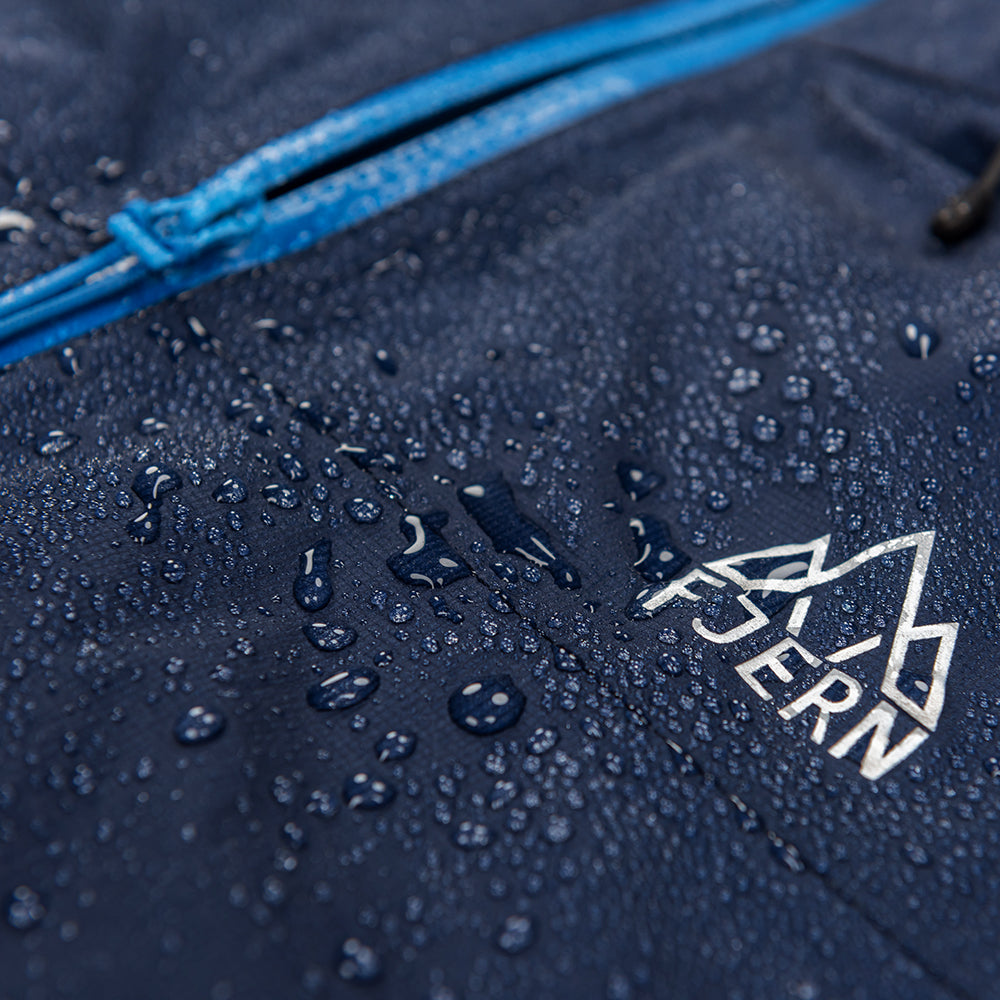 Fjern - Womens Skjold Packable Waterproof Jacket (Navy/Cobalt) | The Skjold is your ultimate shield for fast and light activities, designed to keep you active in any weather