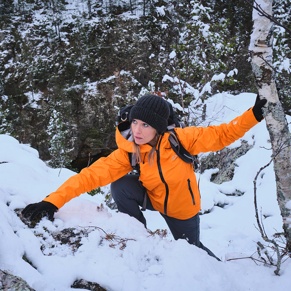 Fjern - Womens Skjold Packable Waterproof Jacket (Sunshine/Navy) | The Skjold is your ultimate shield for fast and light activities, designed to keep you active in any weather